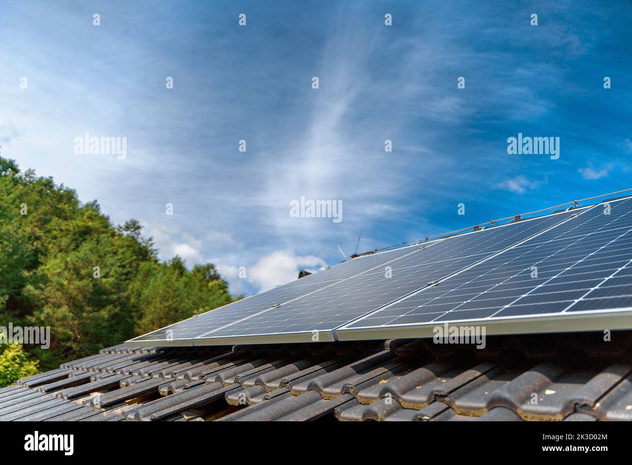 Close-up of solar photovoltaic panels on roof, alternative energy, saving resources and sustainable lifestyle concept. Stock Photo