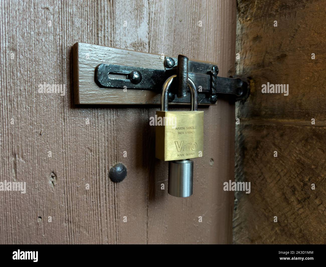Paris, France - Sep 21, 2022: Old door padlock with inox springs at the cathedral with logotype Viro made in Italy manufacturer of Padlocks, Cylinders, Cam Locks, Safes and Security Systems Stock Photo