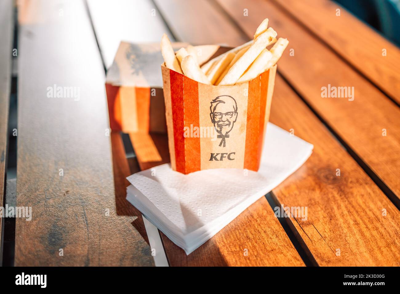 Krakow, Poland - September 11 2022: KFC fast food Fried Chicken (also known as Kentucky Fried Chicken) small box ready to serve to customer, KFC is a Stock Photo