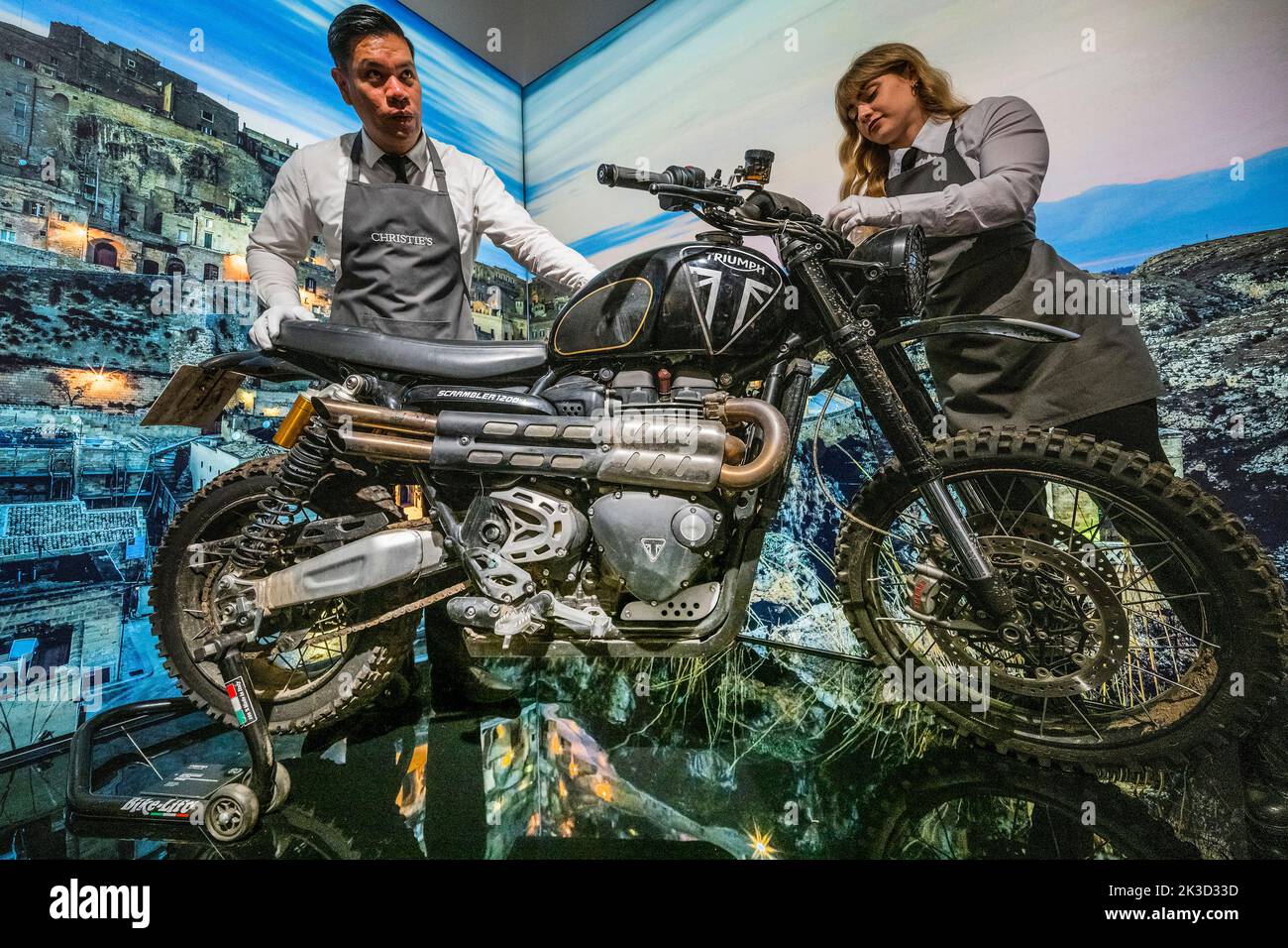 London, UK. 26 Sep 2022. No Time To Die (2021), Triumph Scrambler 1200 XE, (estimate: £20,000-30,000) - To mark the 60th anniversary of the James Bond films, Christie's and EON Productions are holding a charity sale, Sixty Years of James Bond including a total of 60 lots. The live sale (28th Sept) comprises vehicles, watches, costumes and props associated with the 25th film No Time To Die six lots offered celebrating each of the six James Bonds. Credit: Guy Bell/Alamy Live News Stock Photo