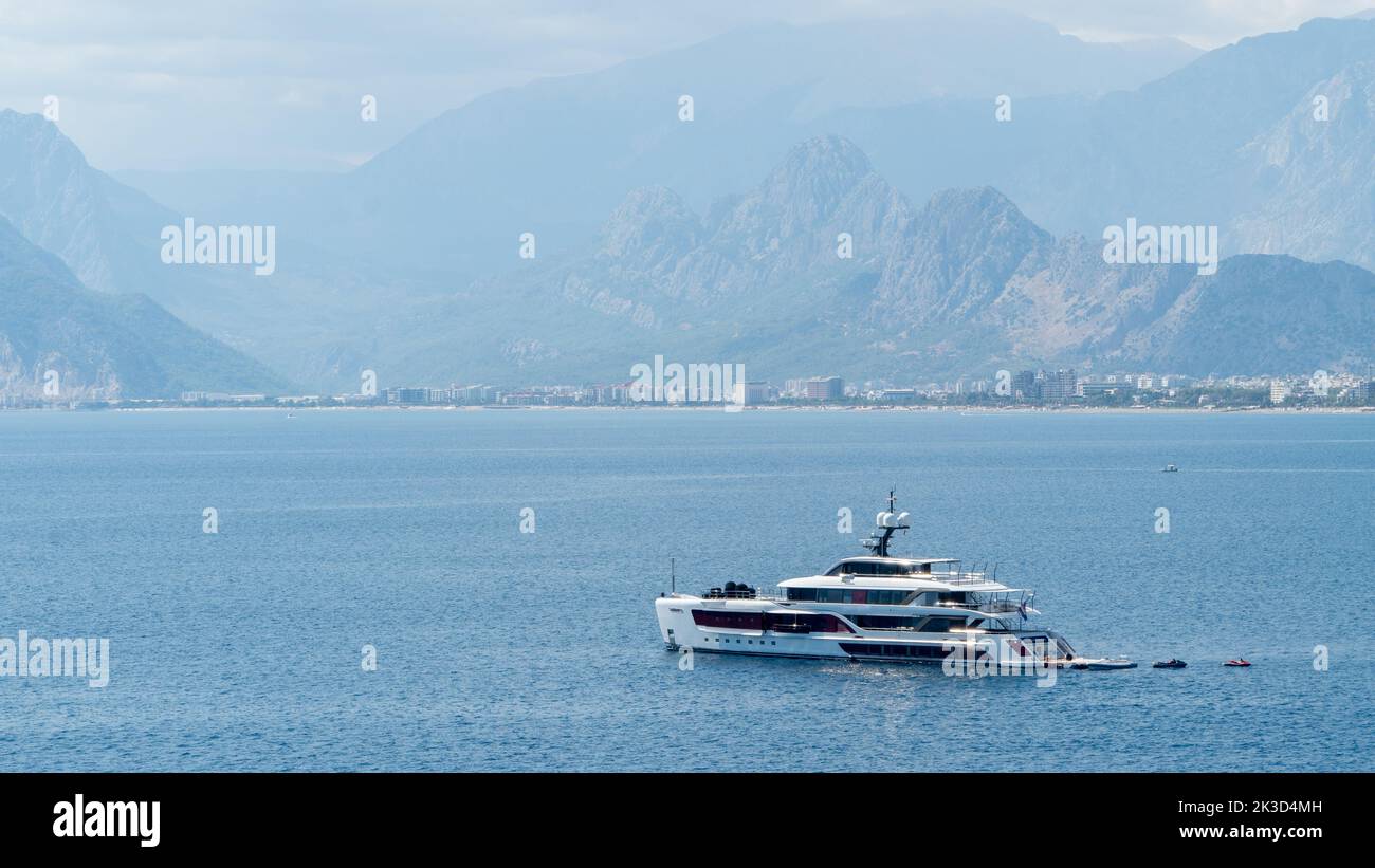 Ship yacht in the sea among the mountains in the fog Stock Photo