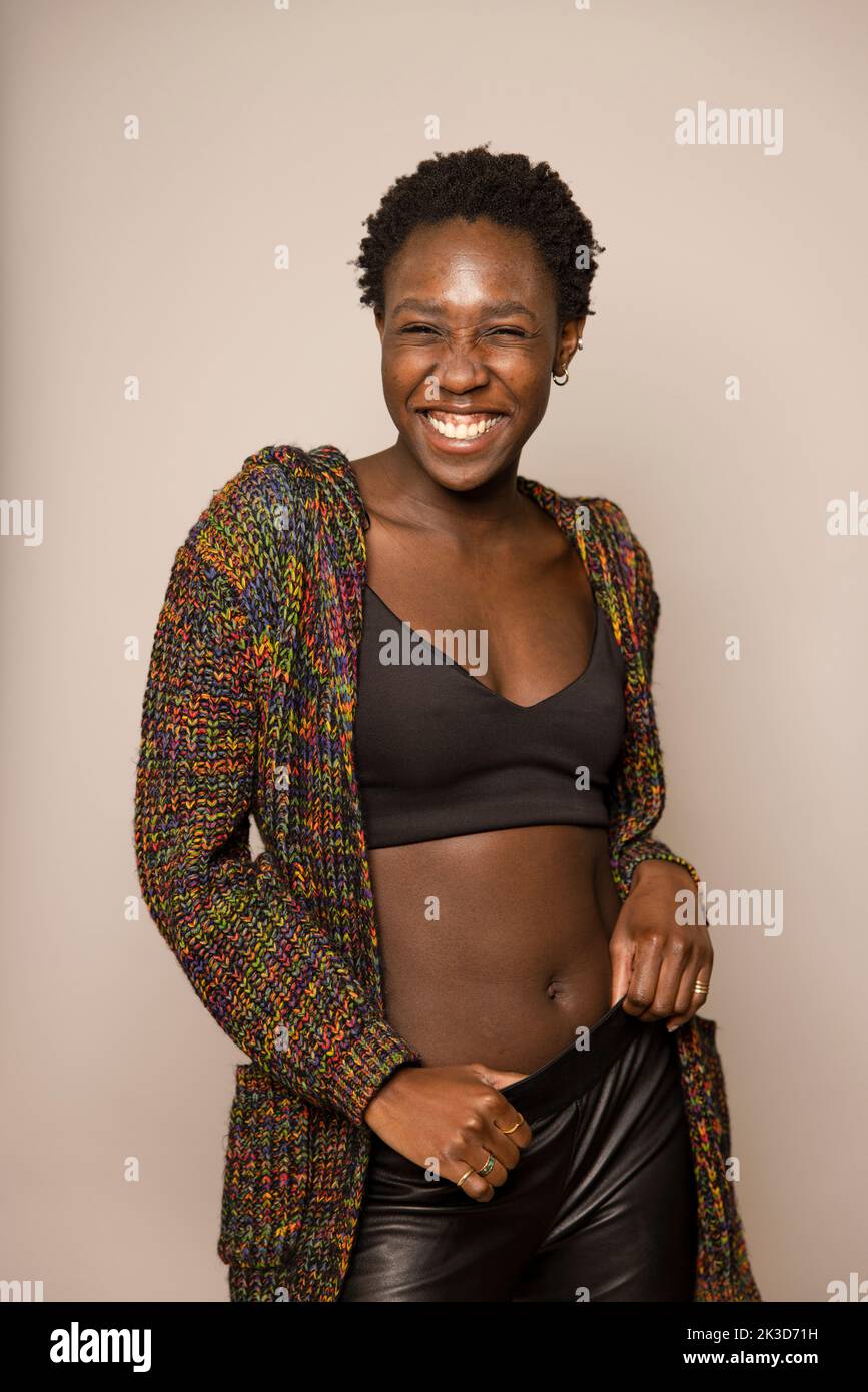 Portrait beautiful young woman in sports bra and sweater Stock Photo