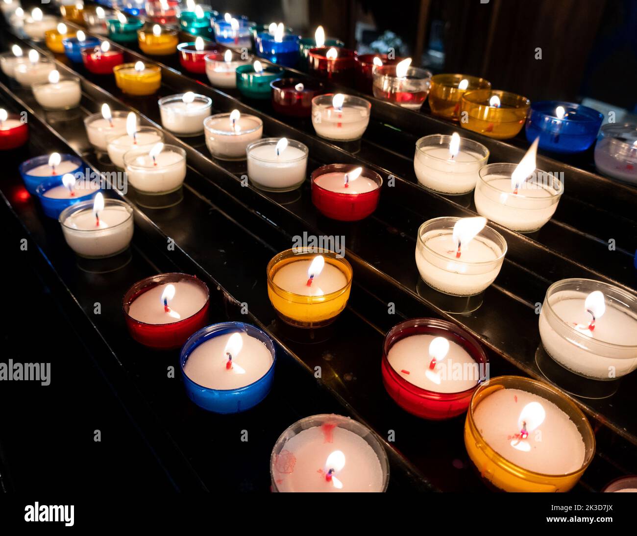 Colorful candles in church Stock Photo