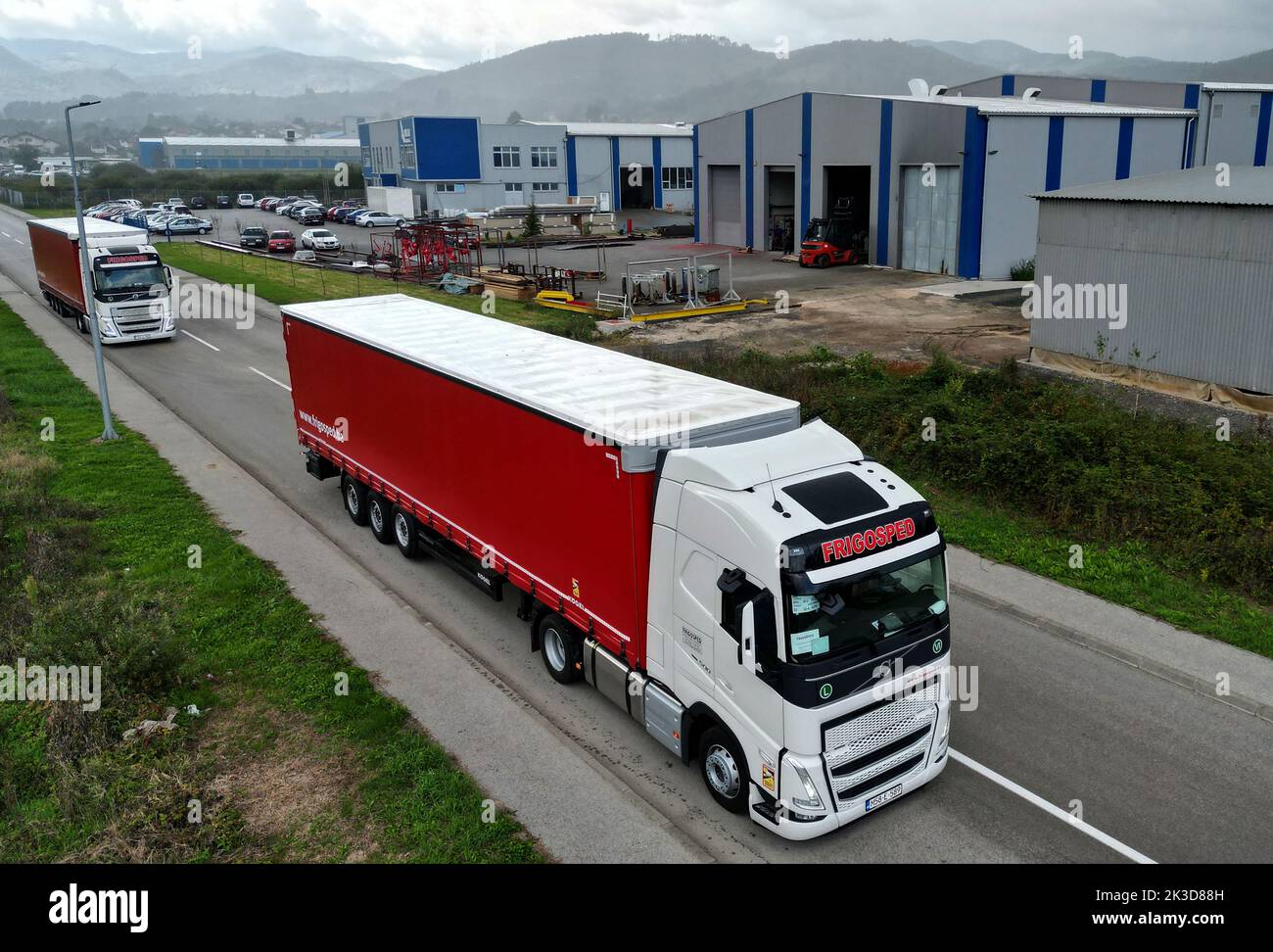 Trucks of international transport company Frigosped drive through Zepce, Bosnia, September 21, 2022. REUTERS/Dado Ruvic Stock Photo