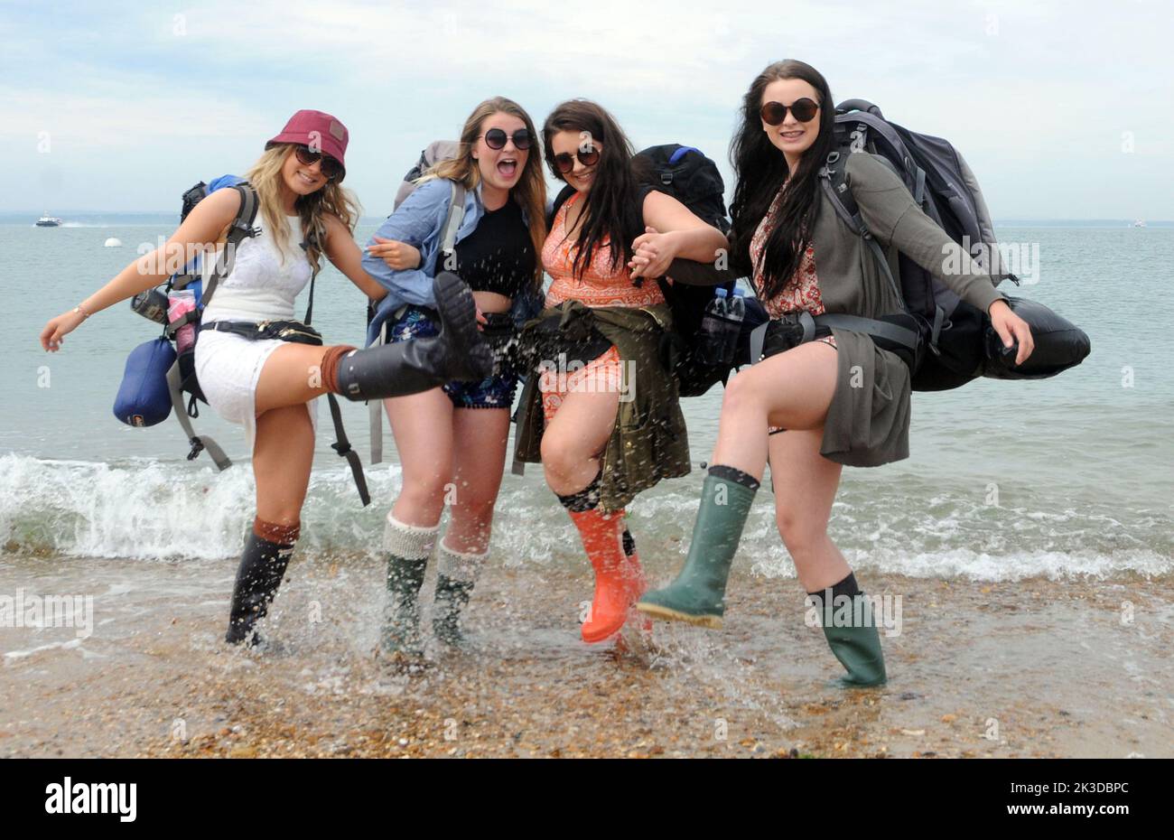 Hi jinks for music fans on the beach at Southsea  left to right, Megan Tiltman, Maddie, Presdee, Becky Martin and Grace |Harris as they wait for the Isle of Wight hovercraft to take them to tne Isle of Wight Music Festival, Pic Mike Walker, Mike Walker Pictures,2015 Stock Photo