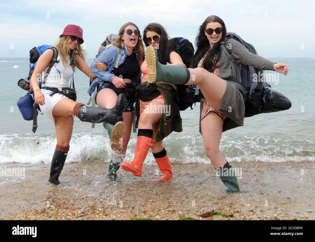 Hi jinks for music fans on the beach at Southsea  left to right, Megan Tiltman, Maddie, Presdee, Becky Martin and Grace |Harris as they wait for the Isle of Wight hovercraft to take them to tne Isle of Wight Music Festival, Pic Mike Walker, Mike Walker Pictures,2015 Stock Photo