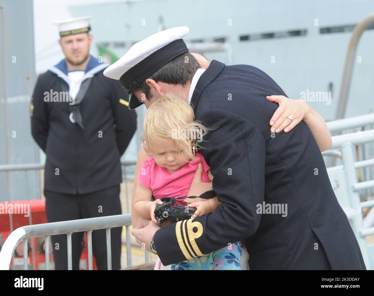 Commanding officer, Lt. Cmdr Steve Banfield greets hia wife Georgie and daughter Arabell, aged one as HMS Severn arrives back in Portsmouth after an eight month deployment in the Caribbean. Pic Mike Walker,2015 Stock Photo