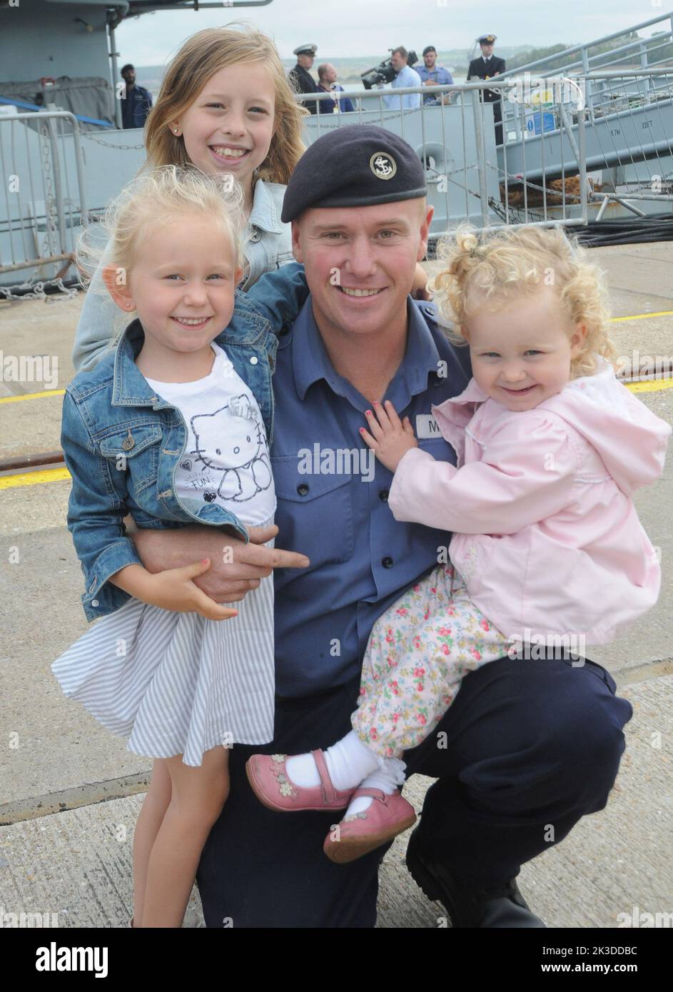 Welcome home dad, daughters, Evie, (5) Leila, 9, and Olivia ,2, are reunited with dad Ian McRobert as HMS Severn arrives back in Portsmouth after an eight month deployment in the Caribbean. Pic Mike Walker,2015 Stock Photo