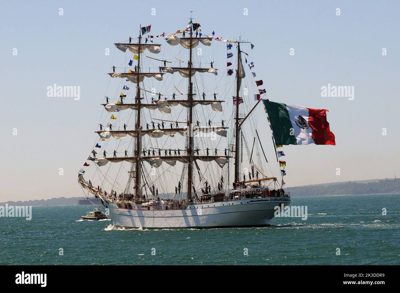 A magnificent surprise for sunbathers at Southsea as the Mexican Navy Sail Training ship, Cuauhtemoc leaves Portsmouth Harbour. Pic Mike Walker, Mike Walker Pictures,2015 Stock Photo