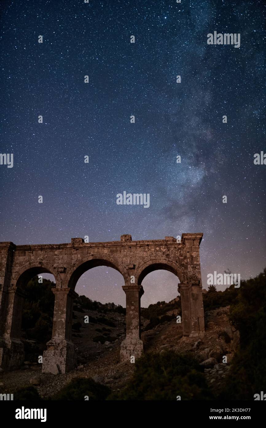The ancient city of Ariassos, the city gate in a night when the Milky Way is visible Stock Photo