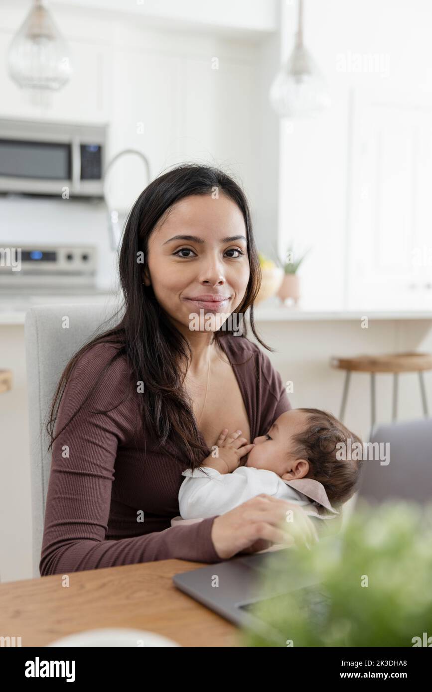 Portrait woman breastfeeding baby hires stock photography and images