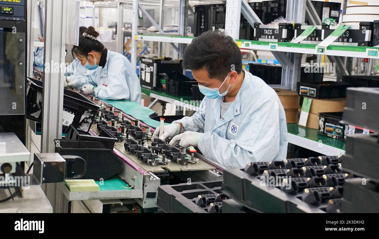 Beijing, China's Shanghai. 26th Mar, 2022. Employees of an auto parts company work at a workshop in Anting Town of Jiading District, east China's Shanghai, March 26, 2022. Credit: Wang Shujuan/Xinhua/Alamy Live News Stock Photo