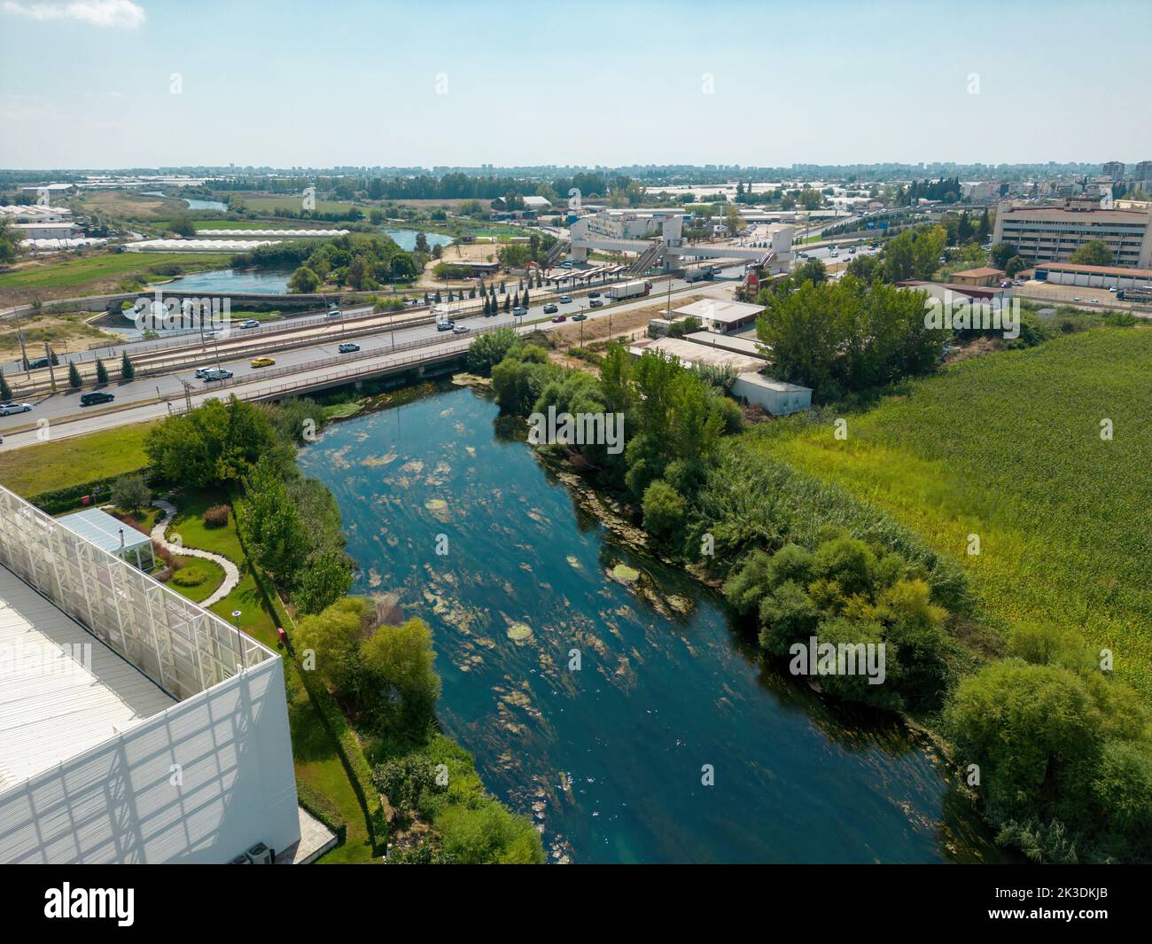 Aerial view of riverside highway on a sunny day Stock Photo