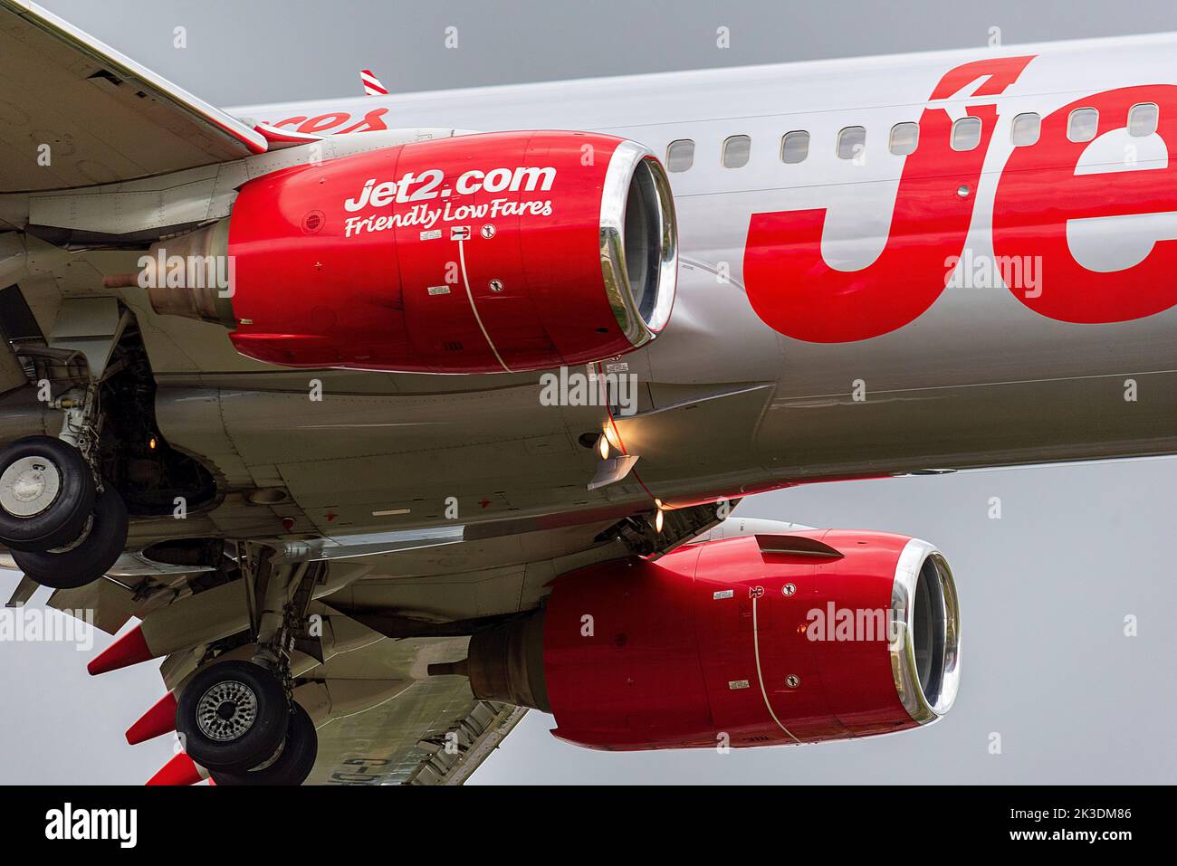 Jet2 Boeing 737 in the air landing with wheels down. Stock Photo