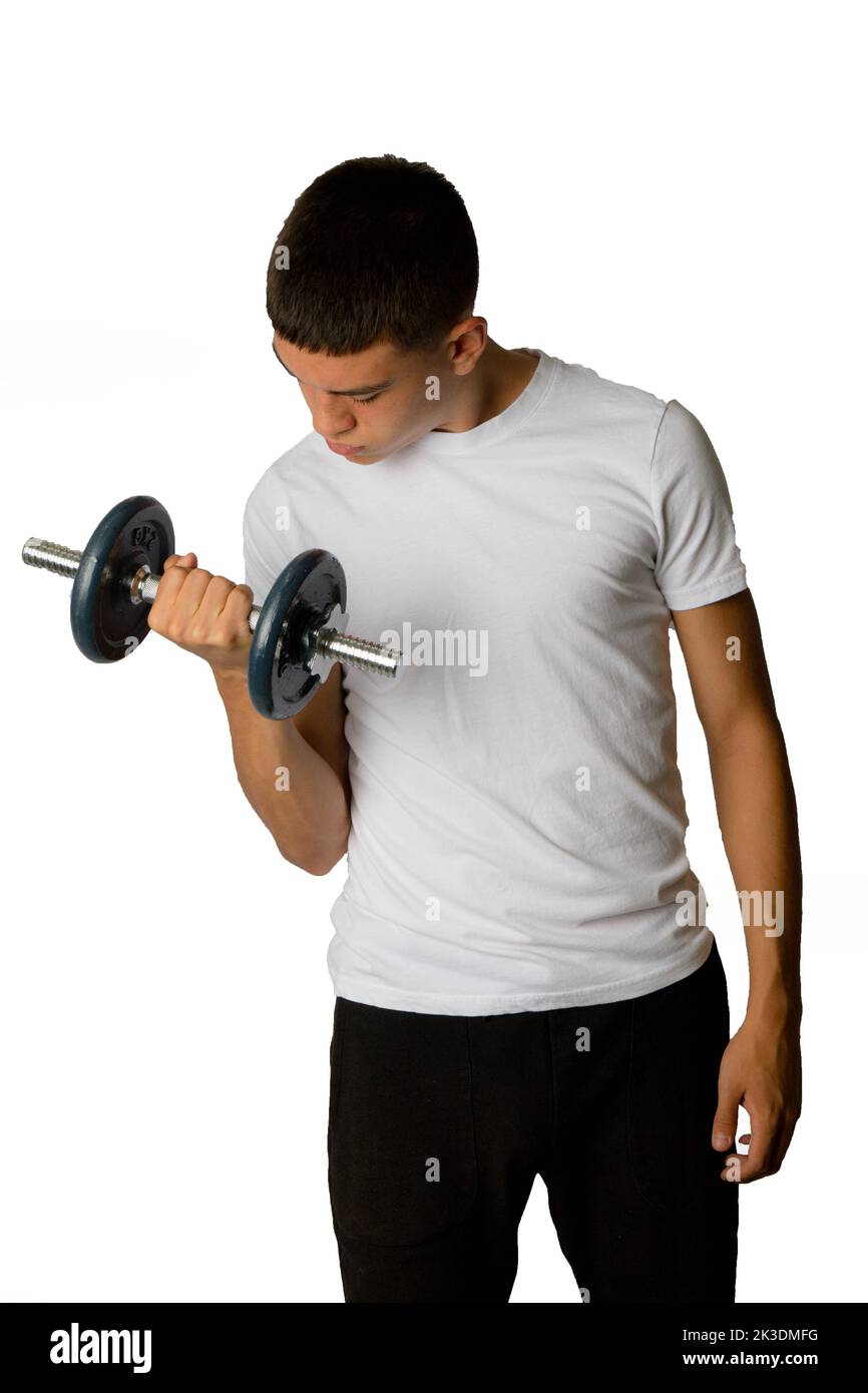 A 19 year old teenage boy lifting a dumbbell Stock Photo