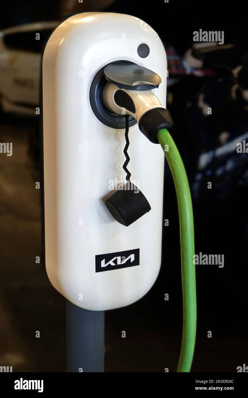 Kia charging station in white with green cable for charging electric cars of the Korean car manufacturer, location Hannover, Germany, September 17, 20 Stock Photo