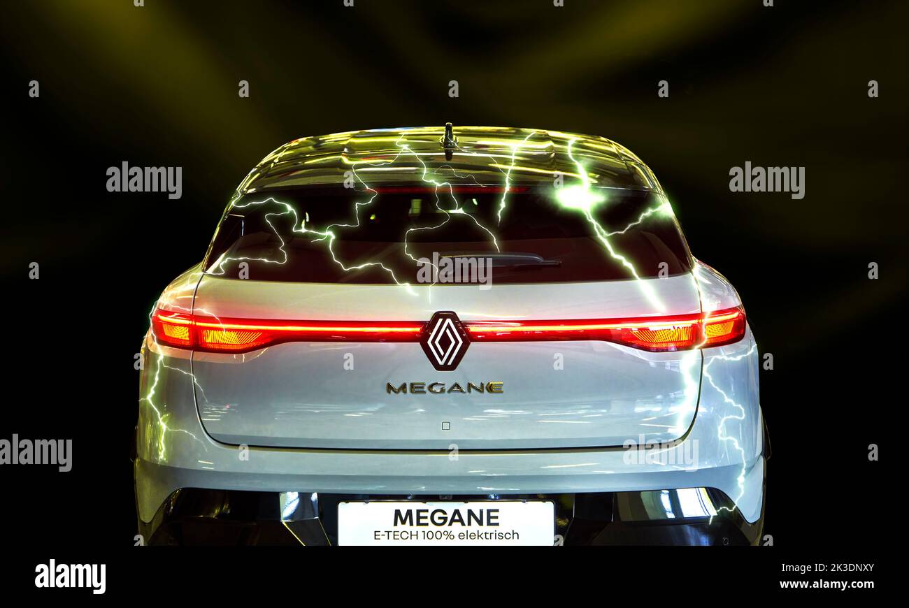 Renault Megane with electric drive in rear view, composite with electric flashes above rear window, vehicle location Hannover, Germany, September 17, Stock Photo
