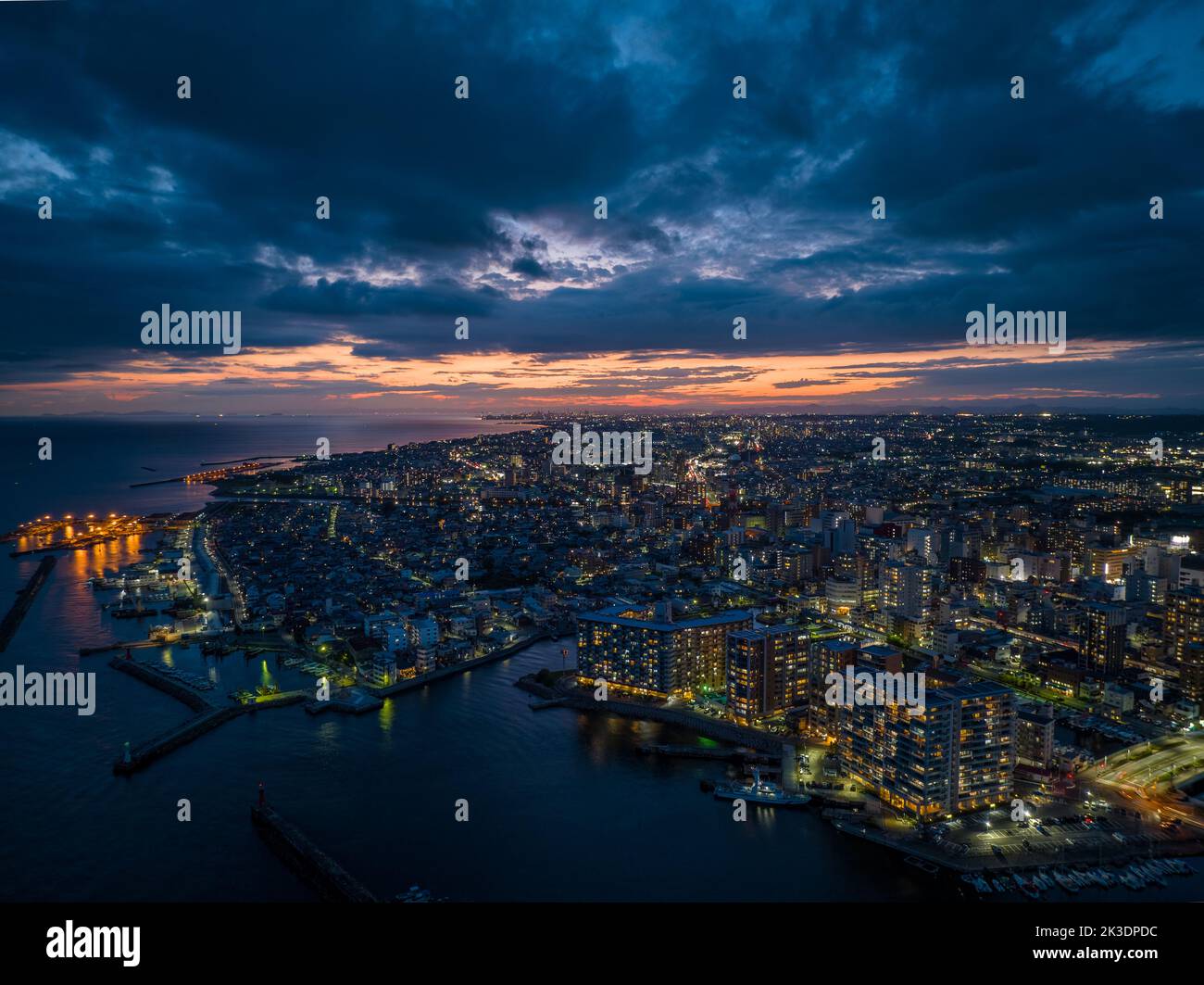 Picture Idea: Dramatic Sky Over Waterfront Apartments In Coastal City In Early