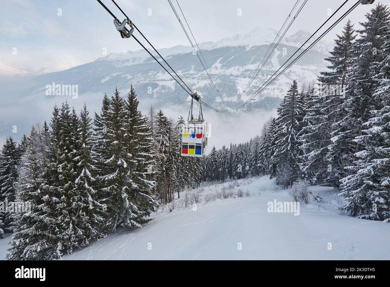 Skiing lift cabin over a valley Stock Photo