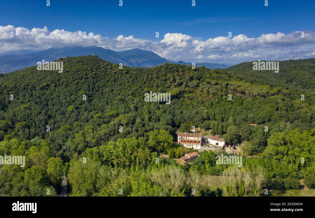 Aerial view of the Olzinelles valley in the Montnegre-Corredor natural park. In the foreground, the Can Valls country house (Barcelona, Spain) Stock Photo