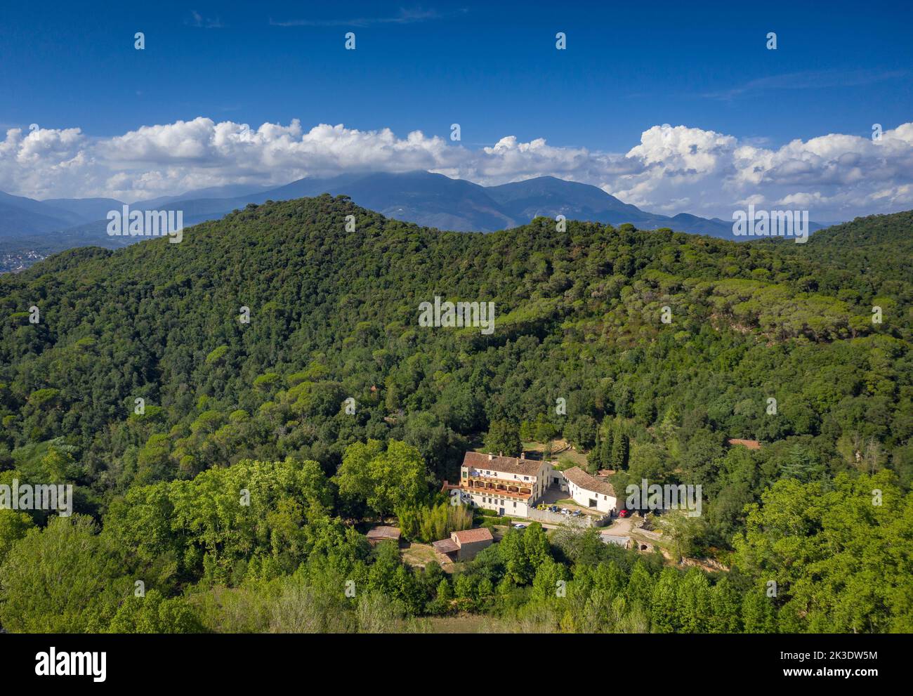 Aerial view of the Olzinelles valley in the Montnegre-Corredor natural park. In the foreground, the Can Valls country house (Barcelona, Spain) Stock Photo