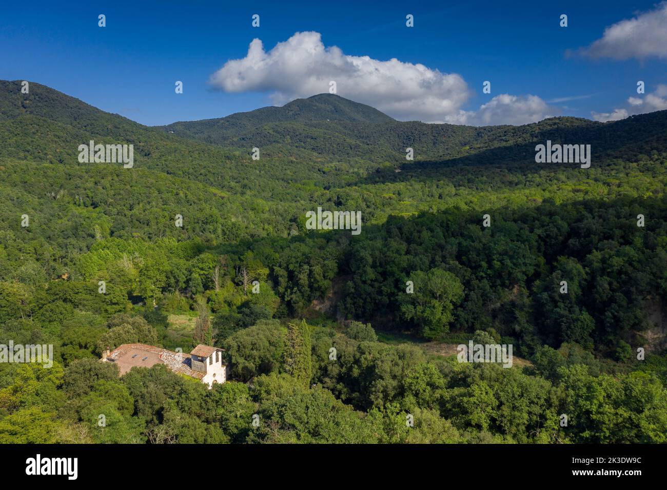 Aerial view of the Olzinelles valley in the Montnegre-Corredor natural park. In the foreground, the rectory of Olzinelles (Barcelona, Spain) Stock Photo