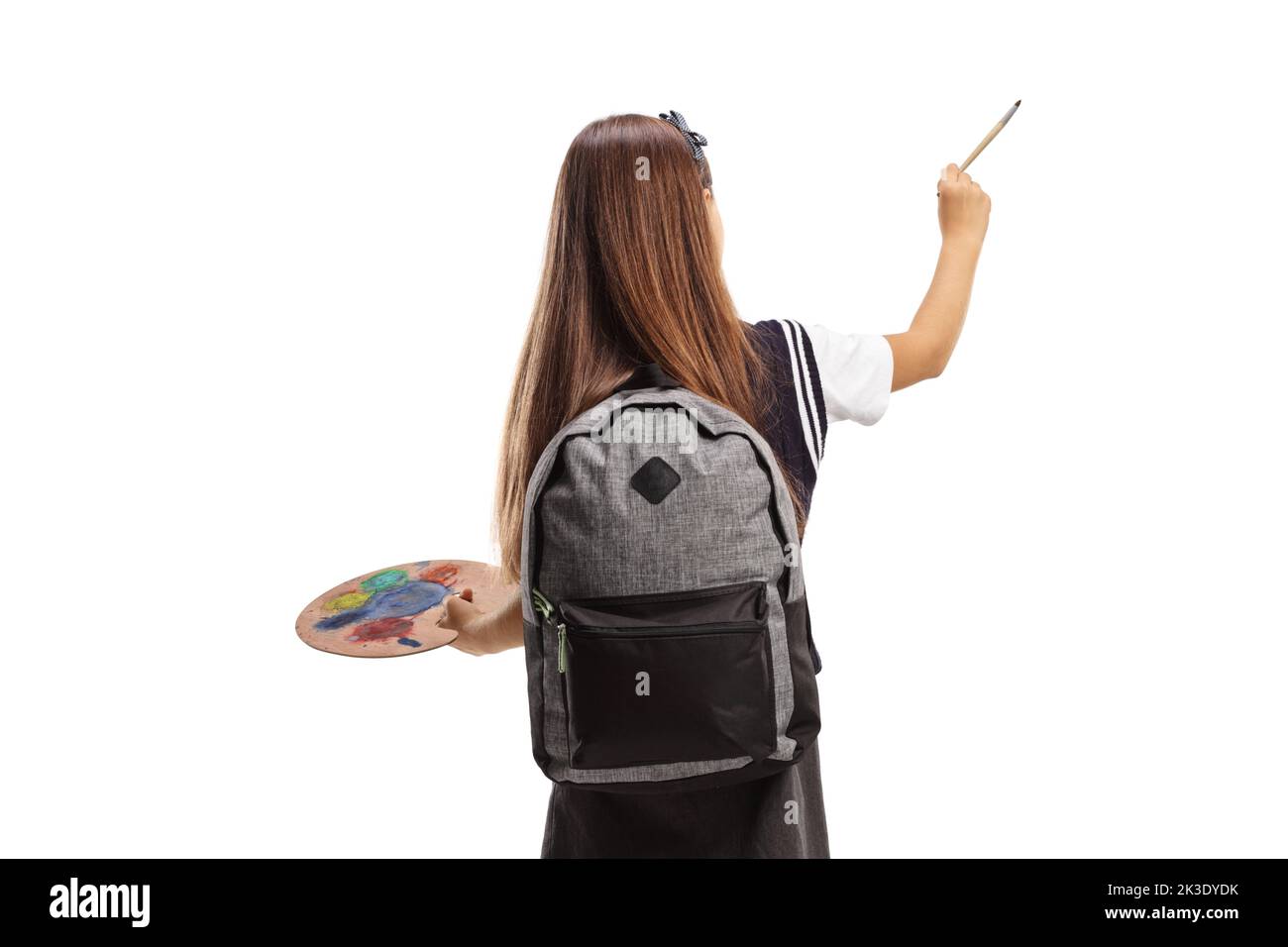 Rear view shot of a student painting with a brush and palette isolated on white background Stock Photo