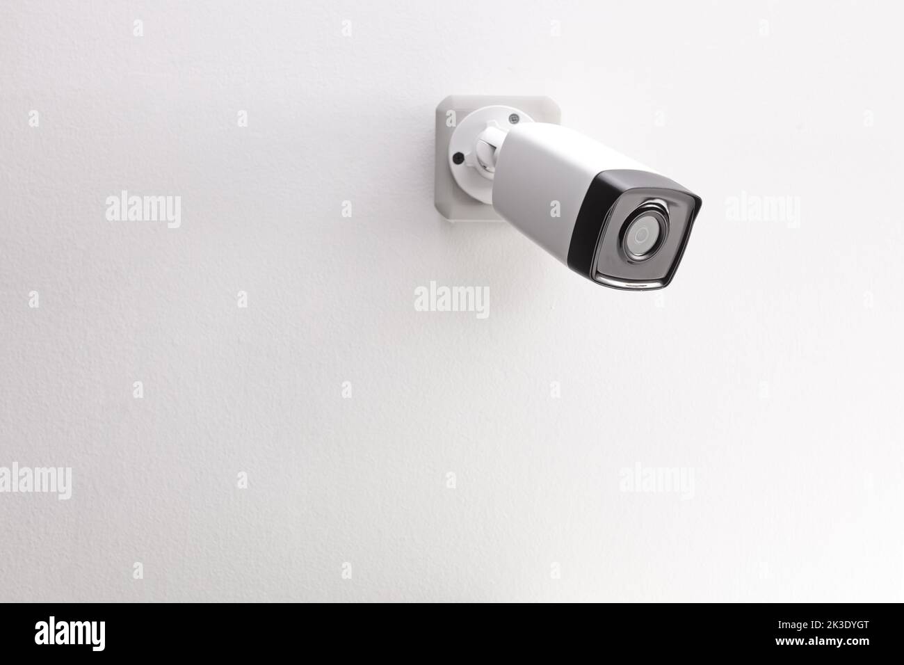 Security camera mounted on a wall Stock Photo