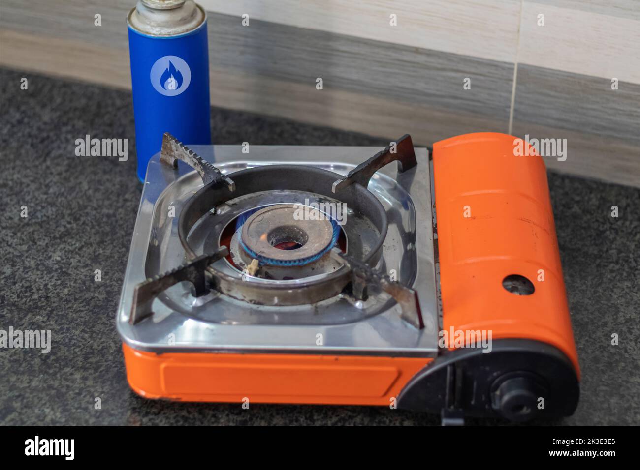 Cooking with natural gas on a portable tourist gas stove as a symbol of