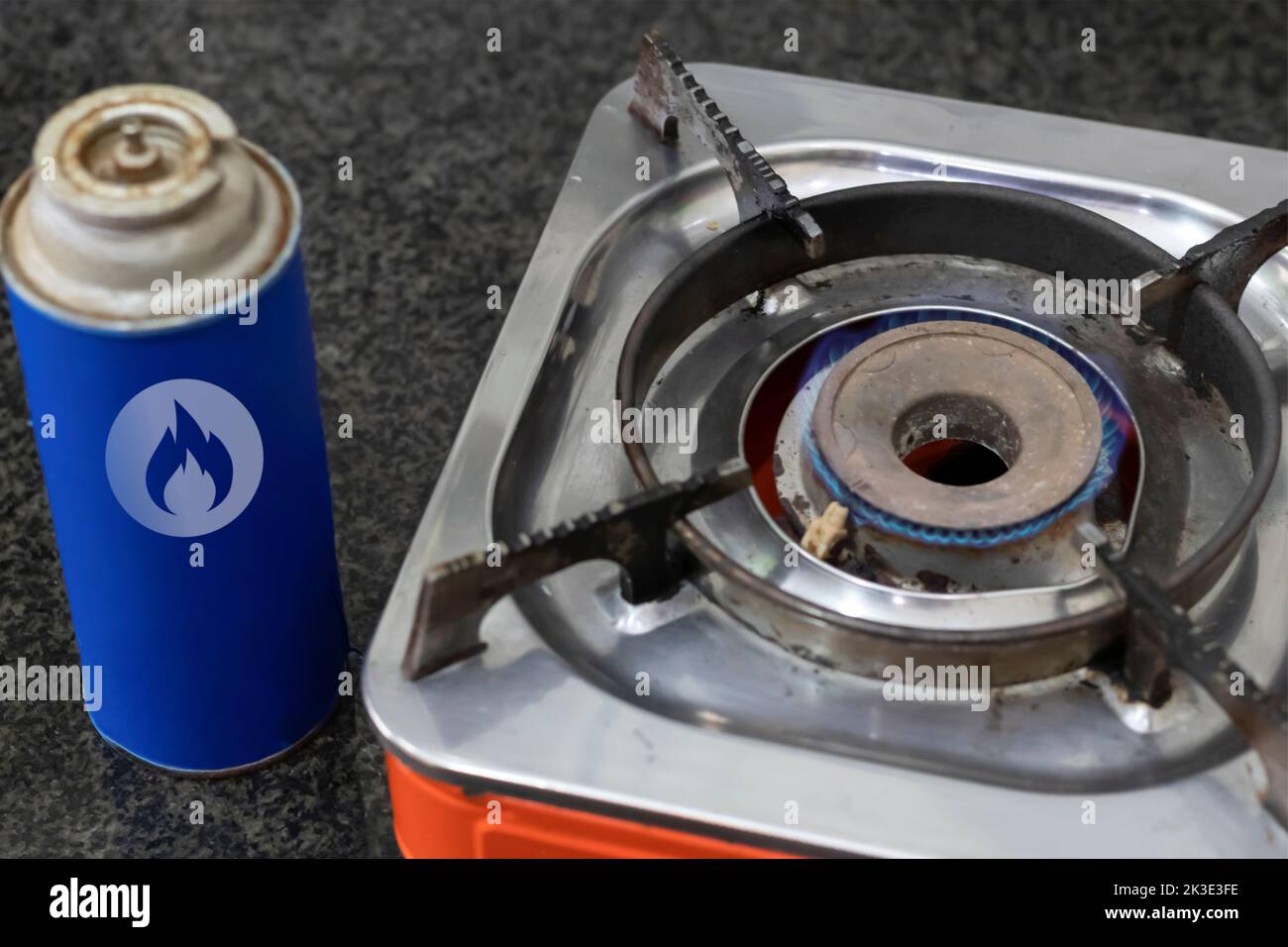Cooking with natural gas on a portable tourist gas stove as a symbol of