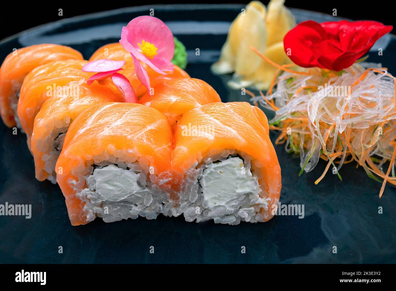 Sushi rolls with cheese and salmon, on a dark background Stock Photo