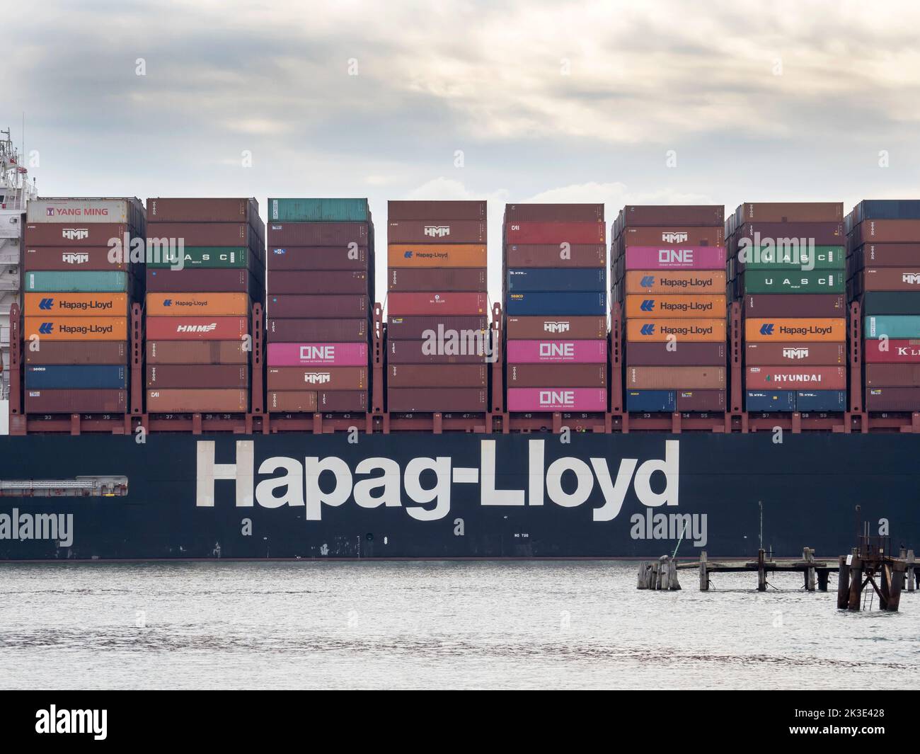 A container ship leaving Southhampton docks in Southampton Water, UK. Stock Photo