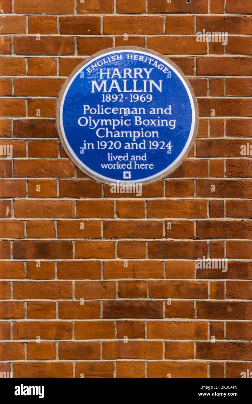 A blue plaque commemorating Harry Mallin, policeman & Olympic boxing champion, on Peel House, Regency Street, London. Stock Photo