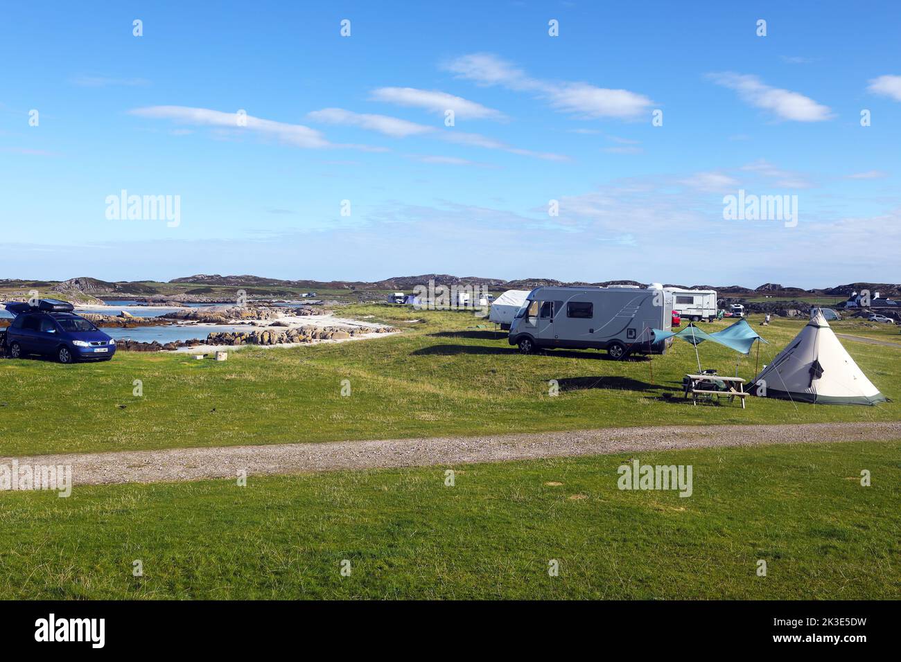 Motorhomes and tents at Fidden farm campsite on theIsle of Mull in the Inner Hebrides of Scotland Stock Photo