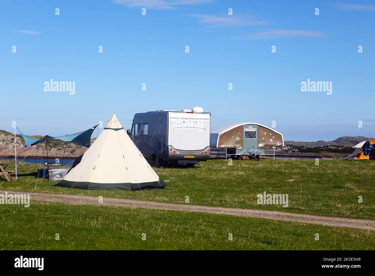 Tents and camper vans at Fidden campsite of the Isle of Mull in the Inner Hebrides of Scotland Stock Photo
