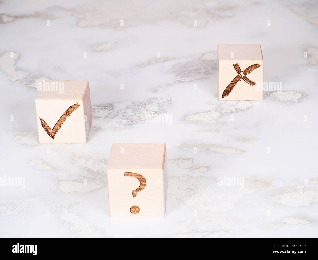 Wooden cubes with check marks as choice and decision making concept Stock Photo