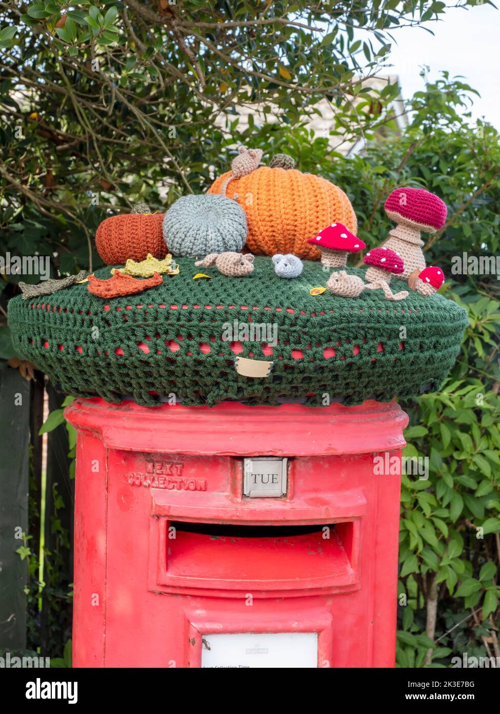 A yarn bombed post box in on the Isle of White, UK. Stock Photo