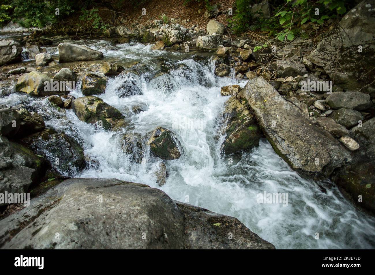 Wild mountain river flowing through rocks Stock Photo - Alamy