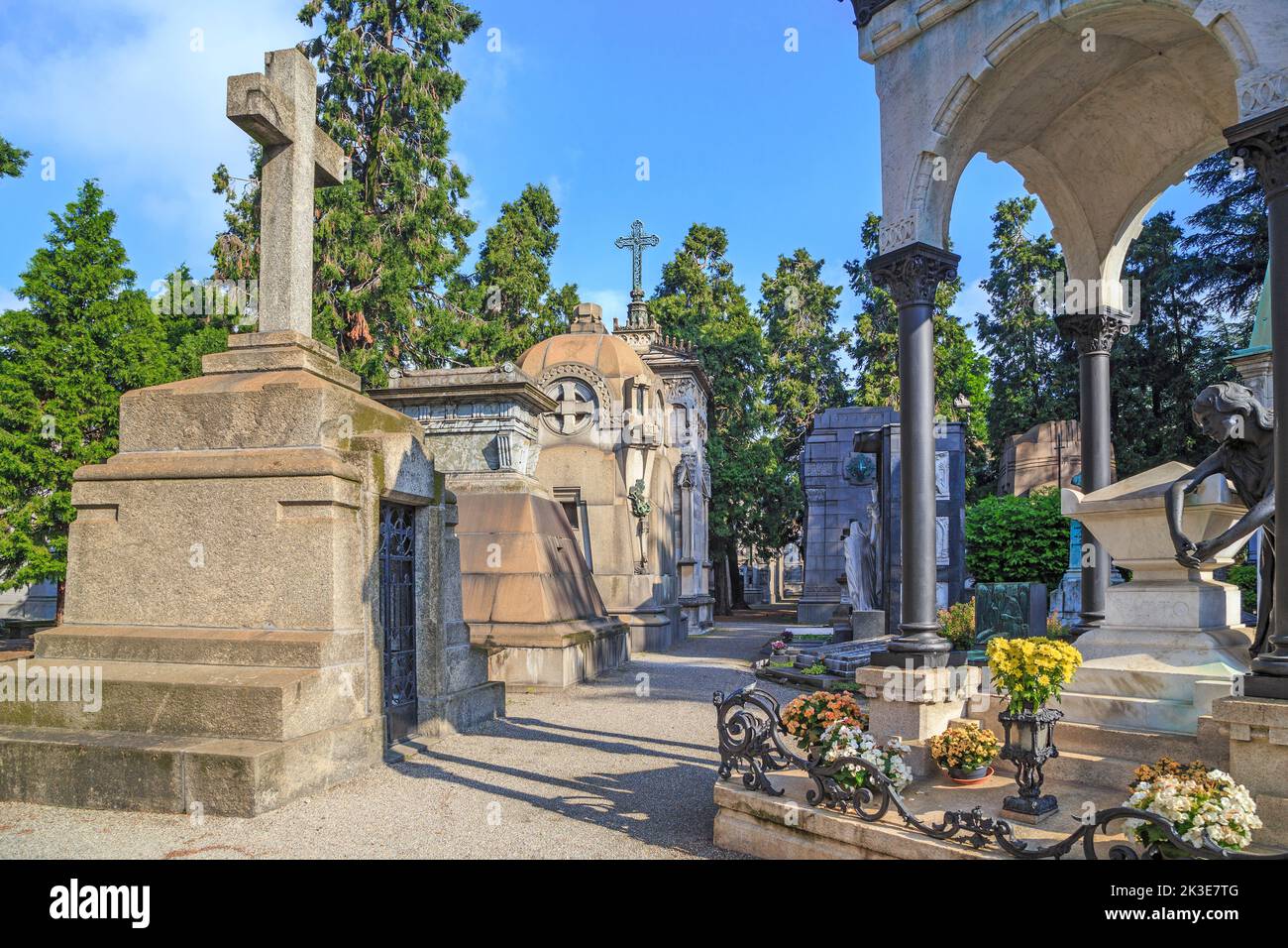 MILAN, ITALY - MAY 17, 2018: This is one of the alleys on the Monumental Cemetery, which is considered one of the richest tombstones and monuments in Stock Photo
