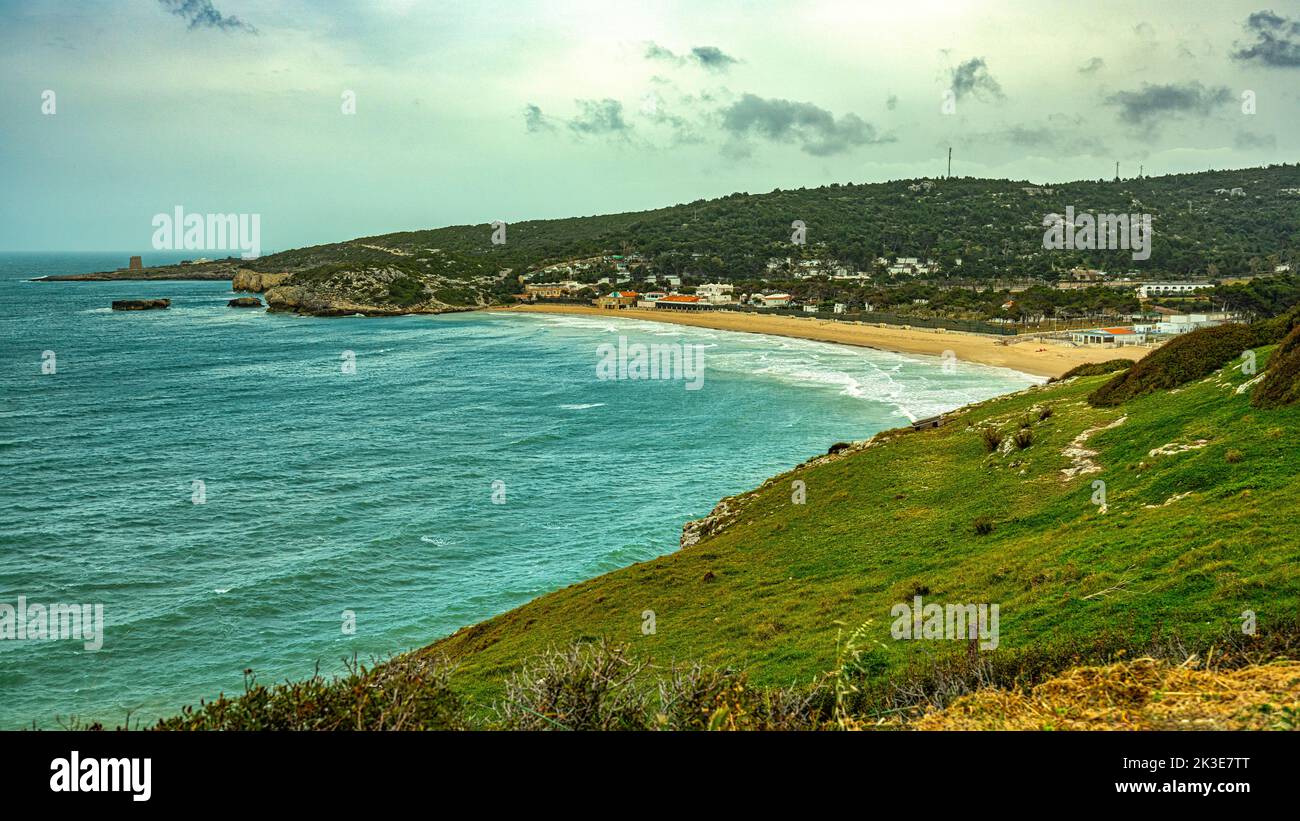 Landscape of the bay and the beach of Manaccora, in the background the watchtower of Calalunga. Peschici, Foggia province, Apulia, Italy, Europe Stock Photo