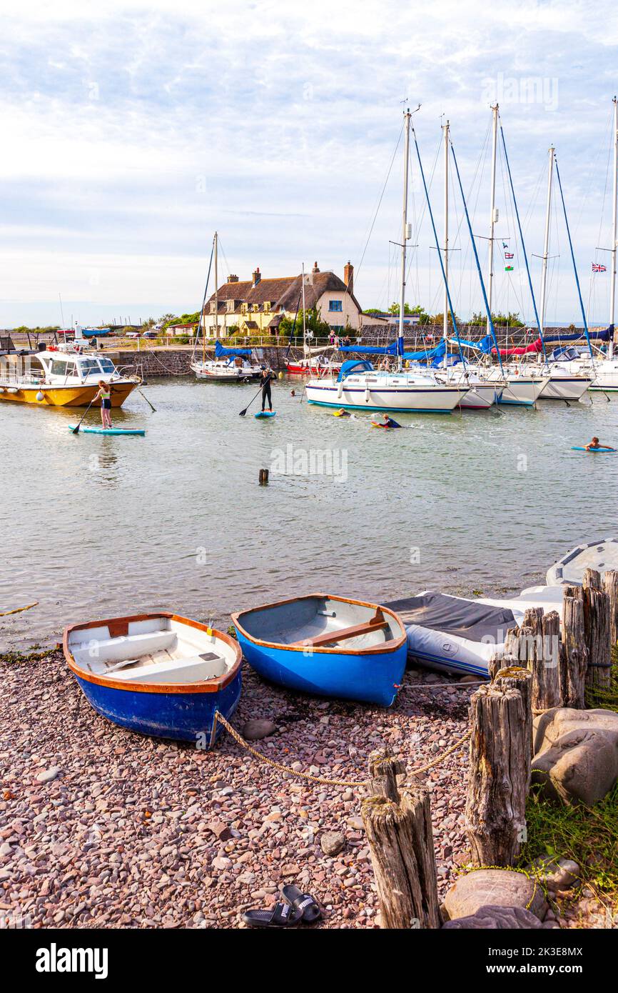 High tide on a summer evening in the harbour on the north coast of Exmoor at Porlock Weir, Somerset UK Stock Photo