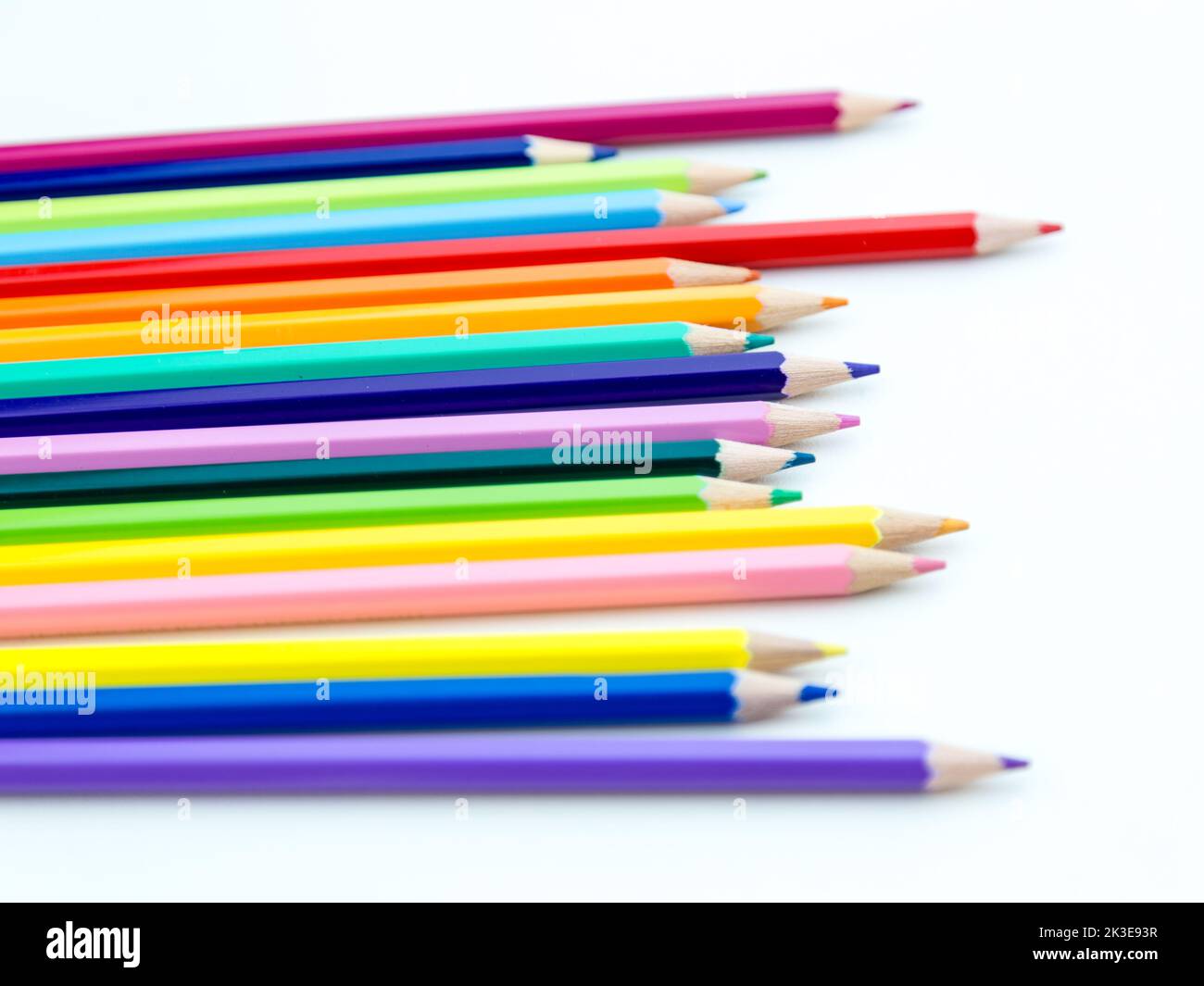 Colored pencil crayons in a row on white background Stock Photo Alamy
