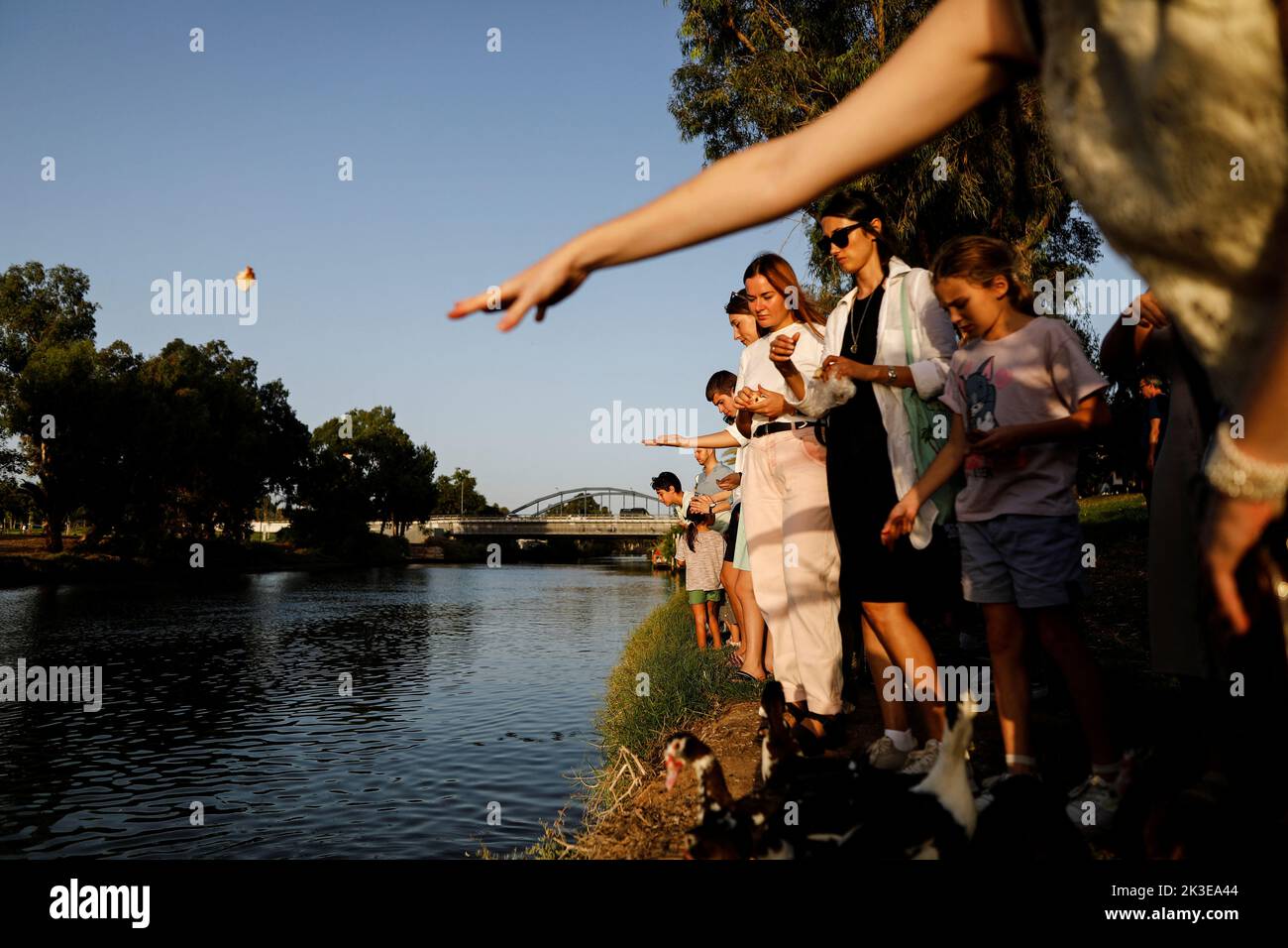 Jews perform a Tashlich ceremony, whereby they symbolically cast away their sins, on a Rosh Hashanah afternoon, the Jewish New Year, by the Yarkon river in Tel Aviv, Israel September 26, 2022. REUTERS/Corinna Kern     TPX IMAGES OF THE DAY Stock Photo