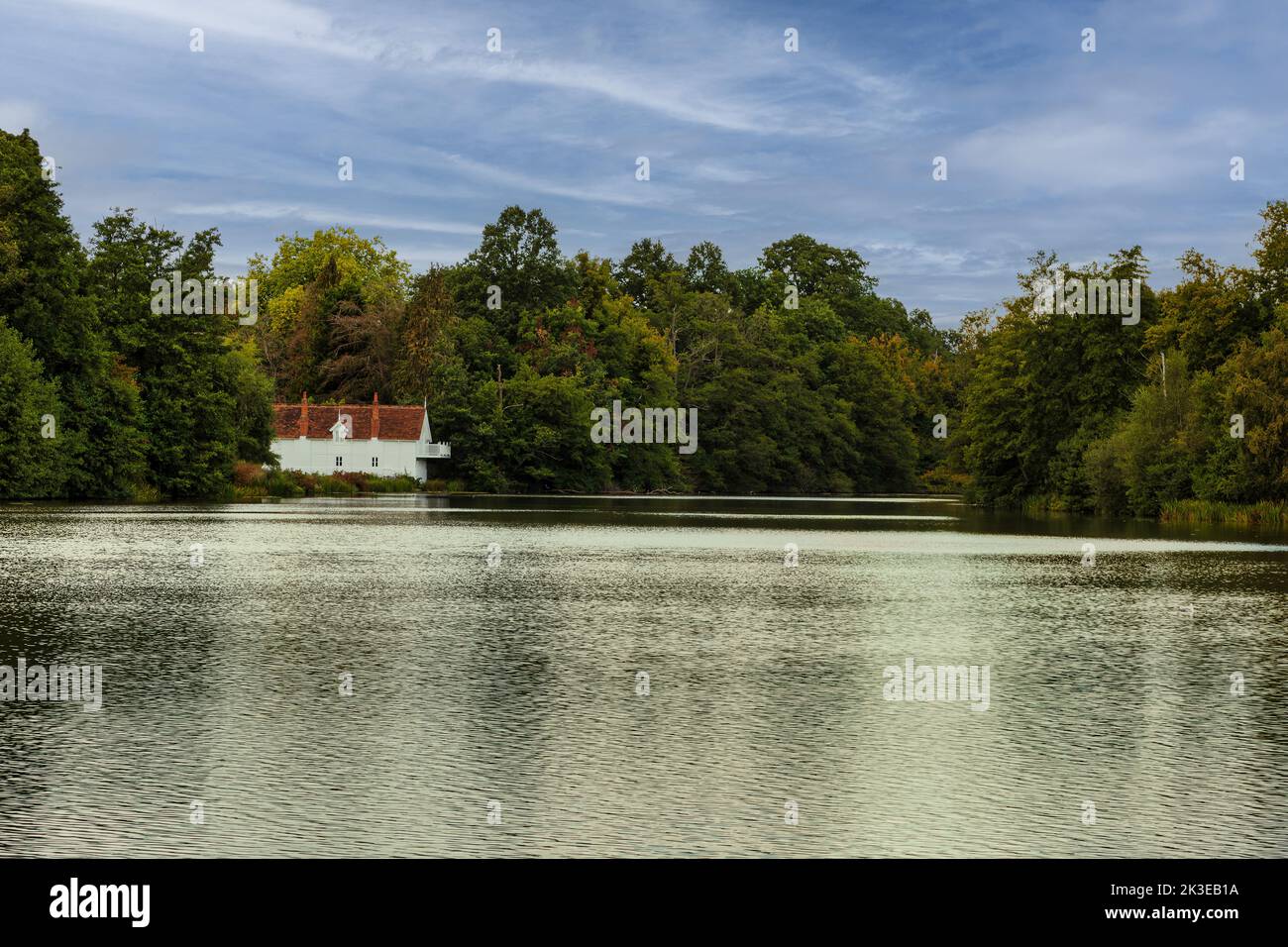 A bright white Boat House at Virginia Water lakes - part of Windsor Great Park, Surrey. Stock Photo