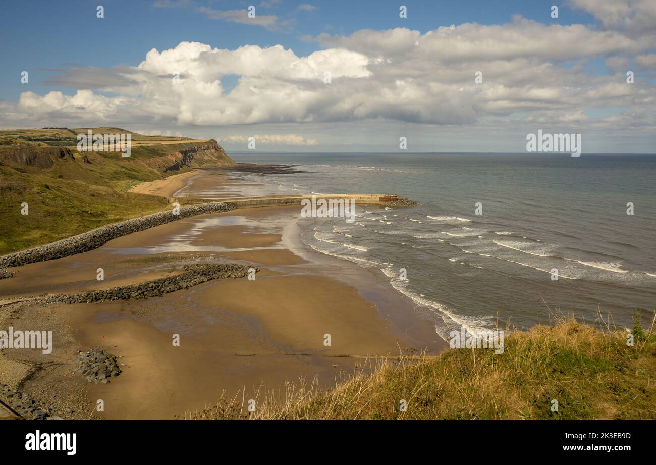 Leave Skinningrove and head south up the steep cliffs on the Cleveland Way heading to Staithes and this is the view from the clifftop of Skinningrove Stock Photo