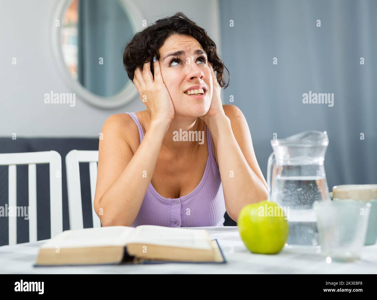 Woman is hysterical about not being able to learn her lessons for exams Stock Photo