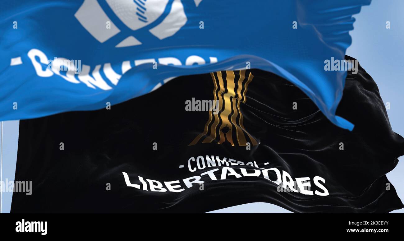 Buenos Aires, ARG, Sept 2022: Flags with the CONMEBOL and Libertadores logo waving. CONMEBOL Libertadores is a South American football competition for Stock Photo