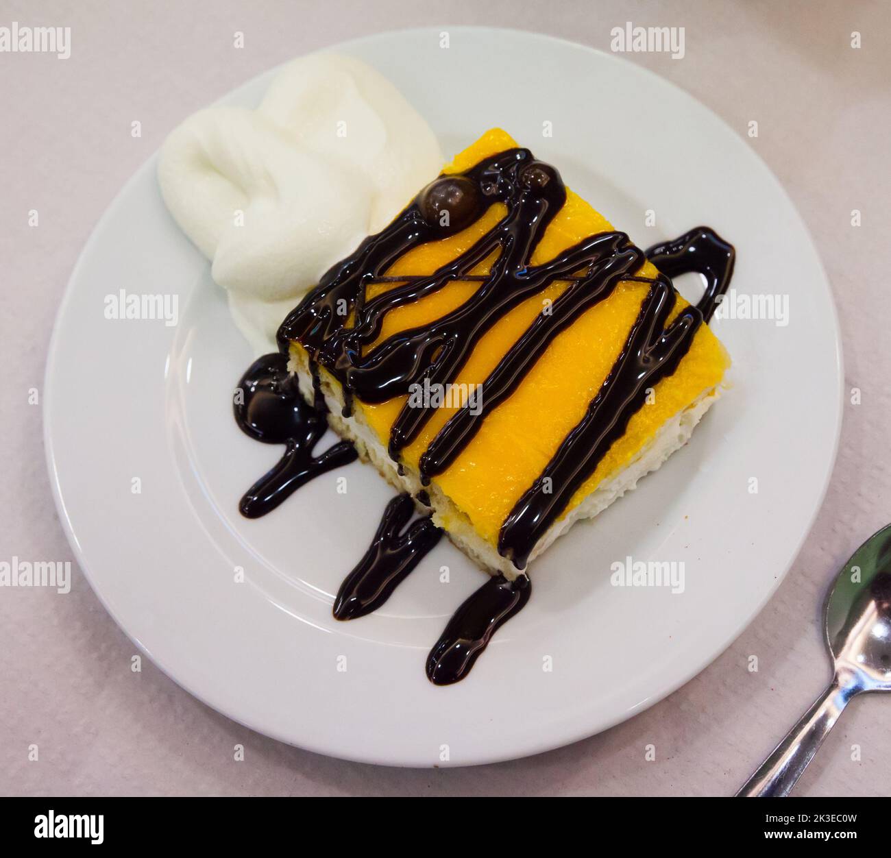 Almond sponge cake with vanilla and chocolate light mousse Stock Photo