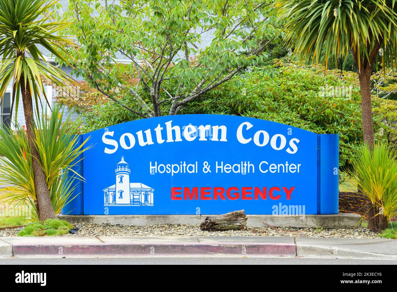 Bandon, OR, USA - September 18, 2022; Blue and white sign for Southern Coos Hospital and Health Center in Bandon Oregon with red emergency information Stock Photo