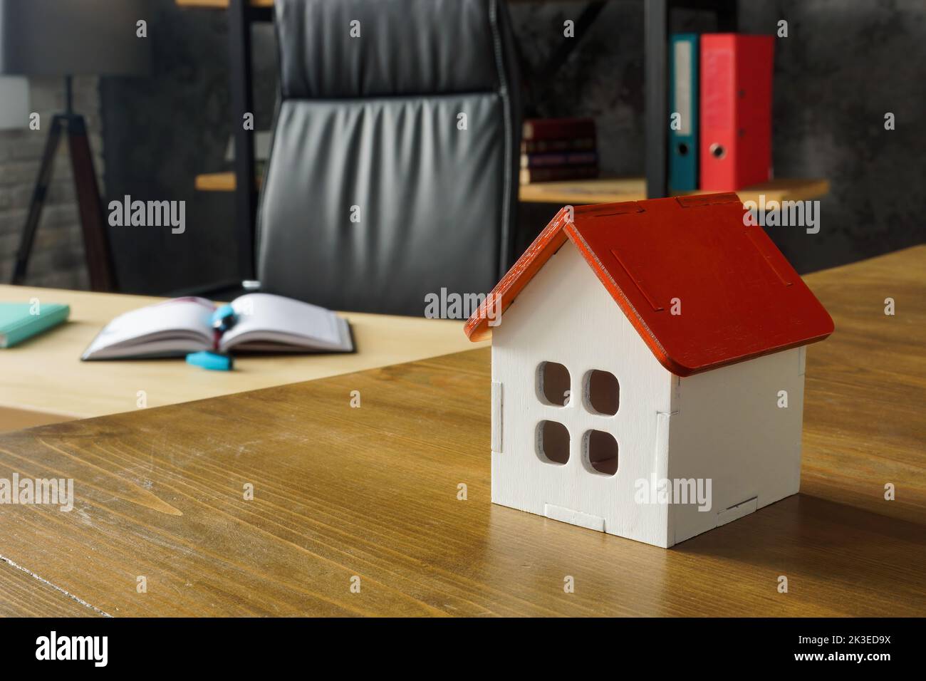 Model of house in the office. Property Inheritance law and taxes concept. Stock Photo